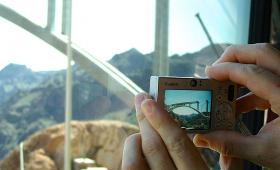 Instructor Phillip Bosshart photographing the construction of the Hoover Dam's arch bridge.